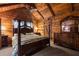 Bedroom with natural wood walls, ceiling fan, and dresser with mirror at 3401 Clay Rd, Austell, GA 30106