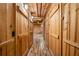 Hallway with wood walls and brick floor leading to other rooms at 3401 Clay Rd, Austell, GA 30106
