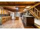View of brick floored kitchen with wood cabinetry, islands, and stainless refrigerator at 3401 Clay Rd, Austell, GA 30106
