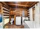 Functional laundry room featuring a washer, dryer, sink, and wood accents, blending practicality with rustic charm at 3401 Clay Rd, Austell, GA 30106