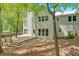 Back exterior view showcasing the deck, large windows, and siding emphasizing modern design at 4380 Laurian Nw Dr, Kennesaw, GA 30144