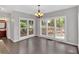 Bright dining area with large windows and views of the wooded property at 4380 Laurian Nw Dr, Kennesaw, GA 30144