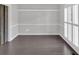 Dining area features wainscoting, shuttered windows, and stylish dark floors at 4380 Laurian Nw Dr, Kennesaw, GA 30144