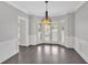 Formal dining room with a chandelier and large bay windows for lots of natural light at 4380 Laurian Nw Dr, Kennesaw, GA 30144