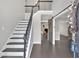 Grand foyer with staircase and barn door providing a glimpse of the living room at 4380 Laurian Nw Dr, Kennesaw, GA 30144