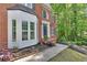 Close-up of brick home with detailed bay window and welcoming front entrance at 4380 Laurian Nw Dr, Kennesaw, GA 30144