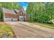 Attractive brick home featuring an extended driveway and well-maintained landscaping at 4380 Laurian Nw Dr, Kennesaw, GA 30144