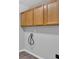 Modern laundry room featuring wooden cabinets above the washer/dryer hookups at 4380 Laurian Nw Dr, Kennesaw, GA 30144