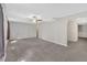 Large carpeted living room with neutral walls and a ceiling fan for added comfort at 4380 Laurian Nw Dr, Kennesaw, GA 30144