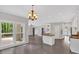 Open floor plan featuring a light-filled living room leading into the kitchen with backyard access at 4380 Laurian Nw Dr, Kennesaw, GA 30144