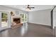 Spacious living room featuring a fireplace and access to outdoor deck at 4380 Laurian Nw Dr, Kennesaw, GA 30144