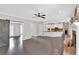 Spacious living room features a fireplace, a ceiling fan, and an open floor plan at 4380 Laurian Nw Dr, Kennesaw, GA 30144