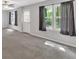 This spacious living room is carpeted and has plenty of natural light at 4380 Laurian Nw Dr, Kennesaw, GA 30144