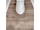 Close-up on a white toilet with wood-look flooring, offering modern convenience at 4380 Laurian Nw Dr, Kennesaw, GA 30144