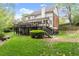 Expansive backyard featuring a deck and mature trees at 4813 Fernie Ne Ct, Marietta, GA 30068