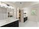 Bright bathroom featuring a tub and double vanity sinks with stylish lighting at 4813 Fernie Ne Ct, Marietta, GA 30068