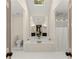 Bright bathroom featuring a tub with a big mirror, a shower and a toilet at 4813 Fernie Ne Ct, Marietta, GA 30068
