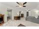 A well-lit bedroom with a ceiling fan, a workspace, and a neutral color scheme for a peaceful atmosphere at 4813 Fernie Ne Ct, Marietta, GA 30068