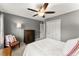 Comfortable bedroom with a ceiling fan, storage, and a cozy seating area at 4813 Fernie Ne Ct, Marietta, GA 30068