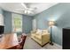 Bedroom in a calming shade of blue with a window and a workspace, creating a perfect space for relaxation and productivity at 4813 Fernie Ne Ct, Marietta, GA 30068