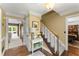Inviting foyer with hardwood floors, staircase, and views into the living and dining rooms at 4813 Fernie Ne Ct, Marietta, GA 30068