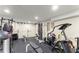 Home gym features weightlifting equipment and rubber flooring to create the ideal workout space at 4813 Fernie Ne Ct, Marietta, GA 30068