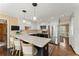 Charming kitchen with white cabinets, stainless steel appliances, and a breakfast bar with seating at 4813 Fernie Ne Ct, Marietta, GA 30068