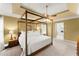The primary bedroom showcases a four-poster bed and lots of space at 4813 Fernie Ne Ct, Marietta, GA 30068