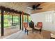 Screened patio features ceiling fan, outdoor seating, and views of the beautiful backyard at 4813 Fernie Ne Ct, Marietta, GA 30068