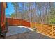 Private backyard featuring a wood fence, concrete patio, and flagstone hardscaping at 5022 Towneship Creek Rd, Roswell, GA 30075