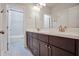 Bright bathroom featuring double sinks and modern fixtures at 5022 Towneship Creek Rd, Roswell, GA 30075