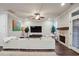 Inviting living room featuring a fireplace, hardwood floors, recessed lights, and lots of natural light at 5022 Towneship Creek Rd, Roswell, GA 30075