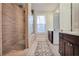 Modern bathroom with a walk-in shower and double vanity at 5022 Towneship Creek Rd, Roswell, GA 30075