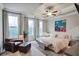 Comfortable main bedroom featuring three windows and a seating area at 5022 Towneship Creek Rd, Roswell, GA 30075