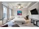 Serene main bedroom with a tray ceiling, neutral decor, and large windows at 5022 Towneship Creek Rd, Roswell, GA 30075