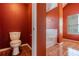 Bathroom featuring a tiled floor, toilet, and tiled tub-shower at 5840 Harrier Ln, Atlanta, GA 30349