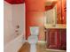 Bathroom with a tub-shower combination, toilet, and vanity at 5840 Harrier Ln, Atlanta, GA 30349