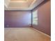 Bedroom has a tray ceiling and natural light from the window at 5840 Harrier Ln, Atlanta, GA 30349