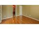 Bedroom with hardwood floors and an ensuite bathroom at 5840 Harrier Ln, Atlanta, GA 30349