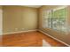 Bedroom featuring a large window and hardwood floors at 5840 Harrier Ln, Atlanta, GA 30349