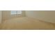 Bedroom with carpet, a window, and neutral paint at 5840 Harrier Ln, Atlanta, GA 30349