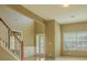 Sunlit foyer with high ceilings, large windows, and wood-look floors at 5840 Harrier Ln, Atlanta, GA 30349