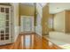 Inviting foyer with soaring ceilings, hardwood floors, and a view of the front door at 5840 Harrier Ln, Atlanta, GA 30349