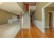 Spacious foyer with staircase, hardwood floors, and views into adjoining living spaces at 5840 Harrier Ln, Atlanta, GA 30349