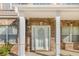 Elegant front door with sidelights and decorative details, complemented by brick facade at 5840 Harrier Ln, Atlanta, GA 30349