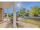Inviting front porch view showcasing well-maintained landscaping and neighboring homes on a sunny day at 5840 Harrier Ln, Atlanta, GA 30349