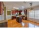 Kitchen with stainless appliances, granite counters, an island, and wood-look floors at 5840 Harrier Ln, Atlanta, GA 30349