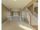 Spacious living room with natural light, decorative columns, and view into the dining area at 5840 Harrier Ln, Atlanta, GA 30349