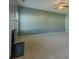 Spacious carpeted living room featuring a fireplace, windows, and ceiling fan at 5840 Harrier Ln, Atlanta, GA 30349