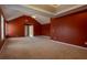 Spacious carpeted main bedroom featuring a tray ceiling, large window, and neutral walls at 5840 Harrier Ln, Atlanta, GA 30349